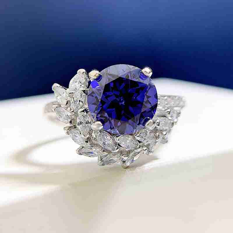 S925 silver engagement ring with a large round purple rhinestone center stone surrounded by clear rhinestones, elegant and sparkling design