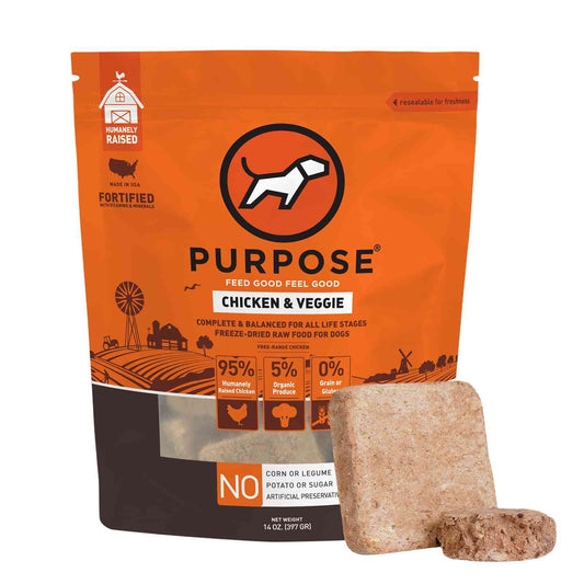 Orange bag of PURPOSE freeze dried raw dog food with black and white dog logo, labeled as chicken and veggie recipe, 14 oz USA made