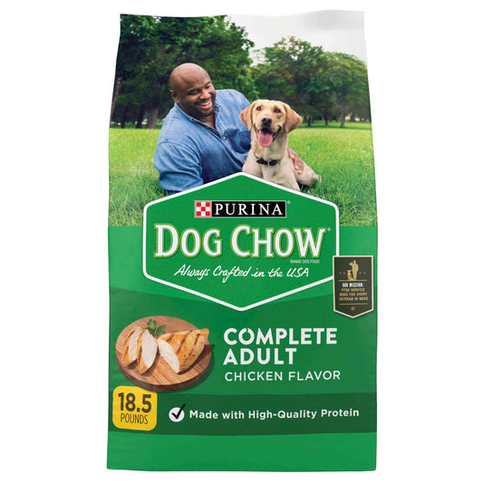 Green bag of Purina Dog Chow Complete Adult Chicken Flavor dry dog food with a man and a happy Labrador in a park, high-quality protein