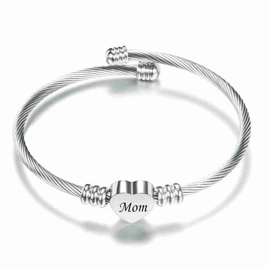 Silver stainless steel braided bracelet with heart charm engraved 'Mom', adjustable design, ideal for Mother's Day gift