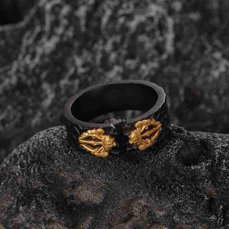 Close-up of black women's adjustable ring with gold dragon head embellishments, made from matte black metal with detailed gold accents, stylish jewelry accessory - SKU: 1781289591634415617