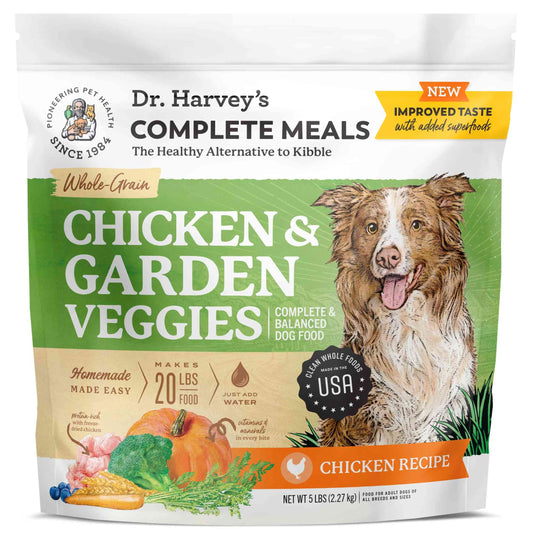 White resealable bag of Dr. Harvey's Chicken & Garden Veggies Dog Food with whole-grain dehydrated chicken, featuring a dog illustration and colorful vegetables, 5-pound size