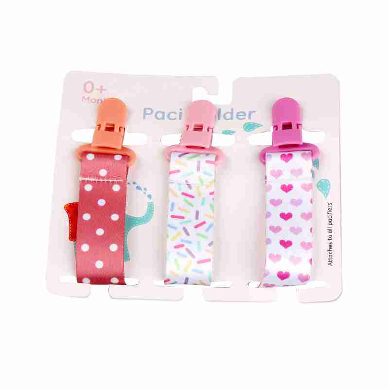Colorful baby pacifier teether clips with pink, orange, and red polka dot fabric, plastic clips, and secure attachment for pacifiers.