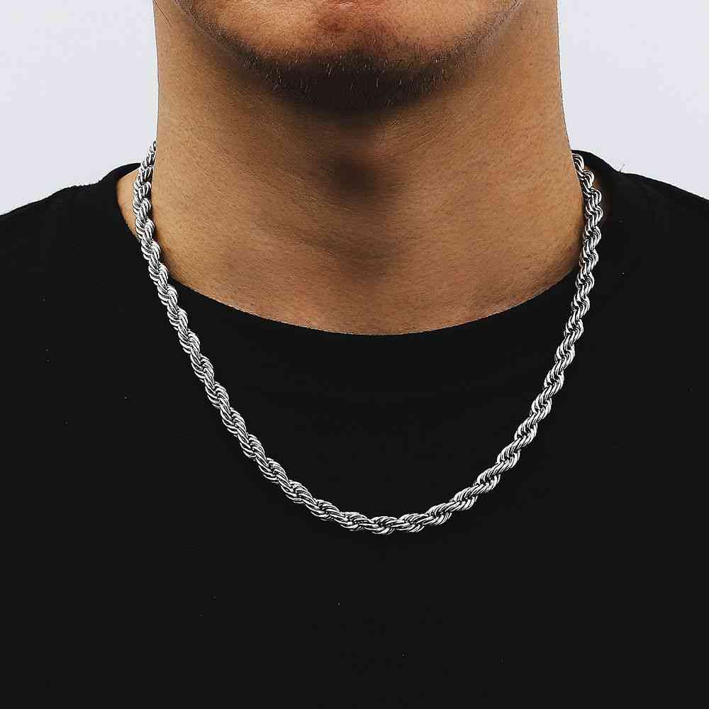 Silver trendy 18K gold plated stainless steel twist chain necklace on a man's neck, stylish jewelry accessory for men