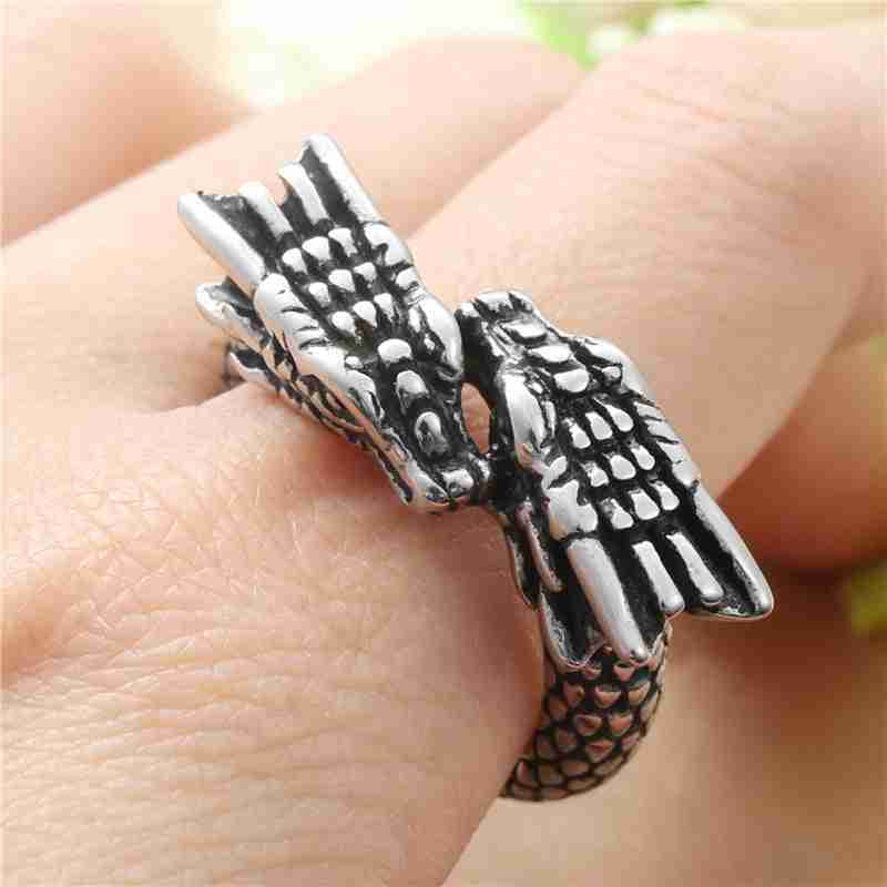Close-up of titanium steel Chinese dragon ring worn on finger, showcasing detailed dragon head and textured scales in a sleek, metallic finish