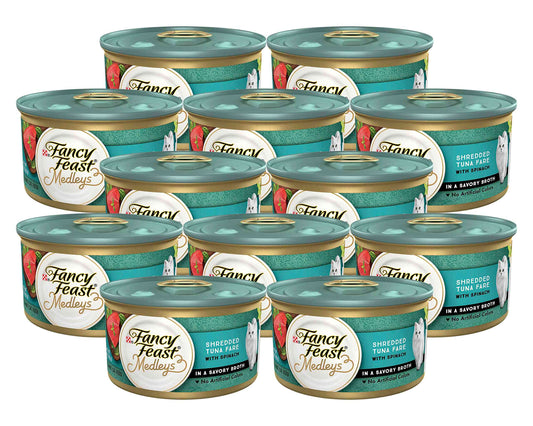 Six cans of Fancy Feast Medleys shredded tuna cat food with spinach in savory broth, featuring a teal lid and colorful label design