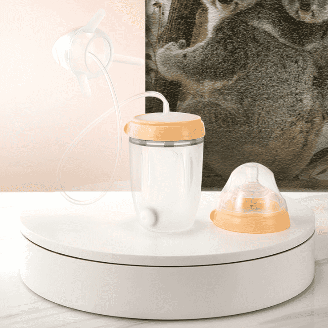 Stylish silicone sippy cups with spouts and rings, perfect for toddler hydration, displayed on a sleek white surface with accessories