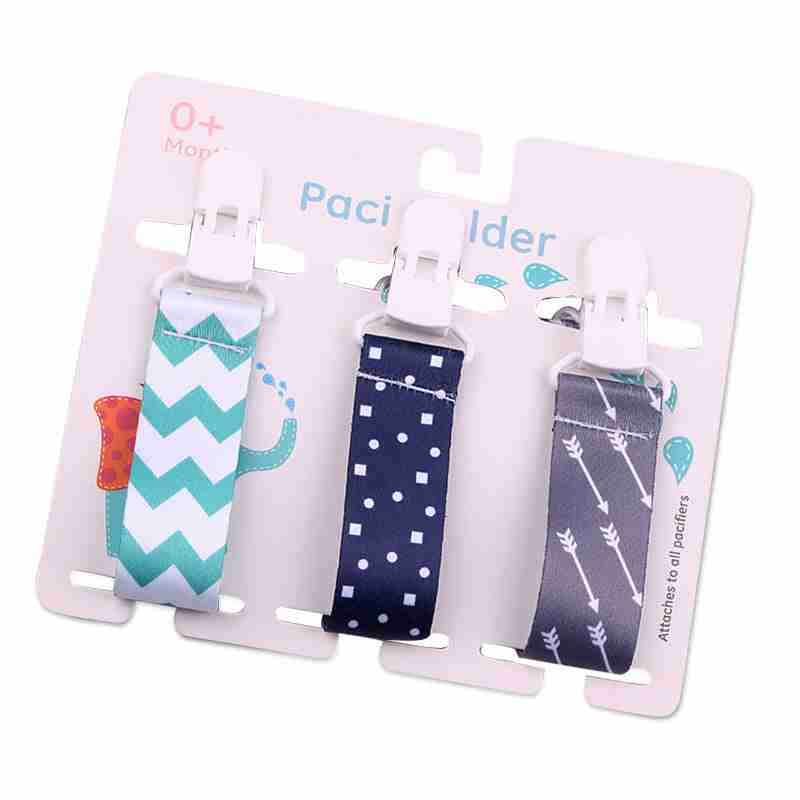 Set of three pink, green, and purple baby pacifier clips with fun patterns, secure clips, and fabric straps for infants
