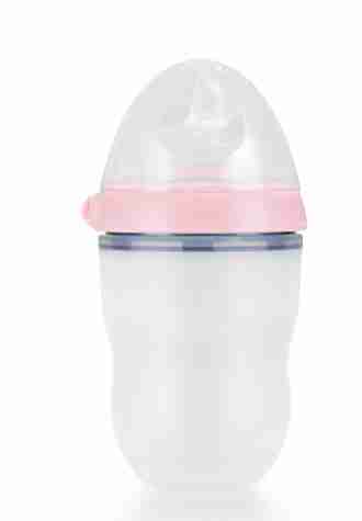 Close-up of silicone sippy cup with pink lid and transparent body, designed for young children to drink comfortably