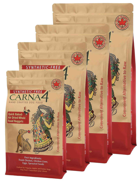 Four beige resealable bags of Carna4 Hand Crafted Dog Food with colorful artwork of a dog and rooster, labeled 'SYNTHETIC-FREE' and 'Raw' for dogs