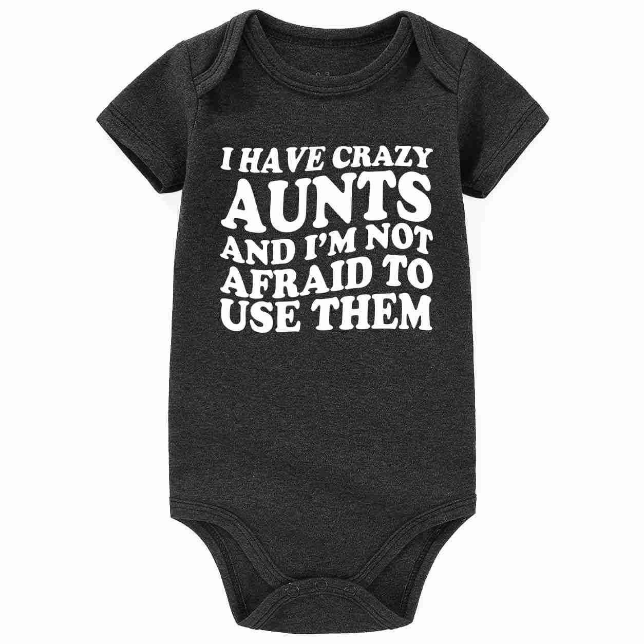 Gray baby bodysuit with bold white text reading 'I HAVE CRAZY AUNTS AND I'M NOT AFRAID TO USE THEM,' short sleeves, 3-6 months size, soft cotton material - SKU: B0CP8XQ98Z