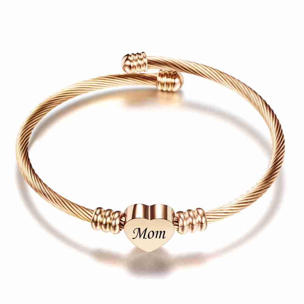 Stainless steel braided mother's day bracelet with a heart-shaped charm engraved with 'Mom', featuring a rose gold finish and adjustable design