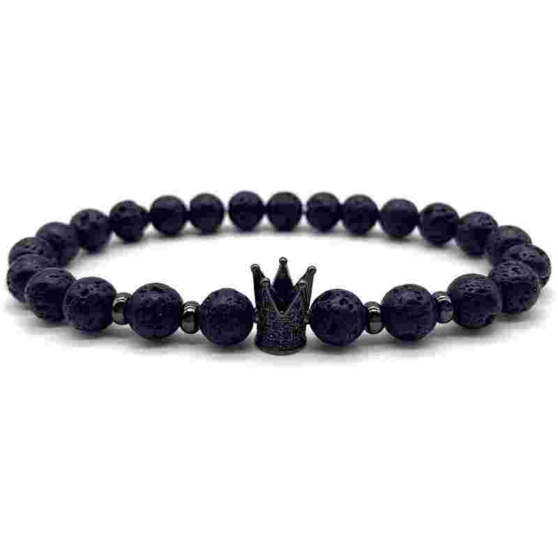 Black volcanic stone beaded stretch bracelet with gold crown charm, lava stones, elastic, elegant jewelry design
