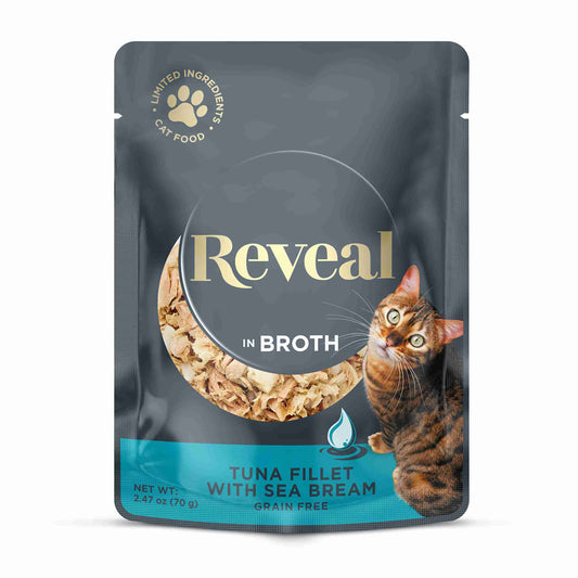 Gray resealable pouch of Reveal natural wet cat food with tuna and sea bream in broth, featuring a cat illustration and net weight of 2.47oz