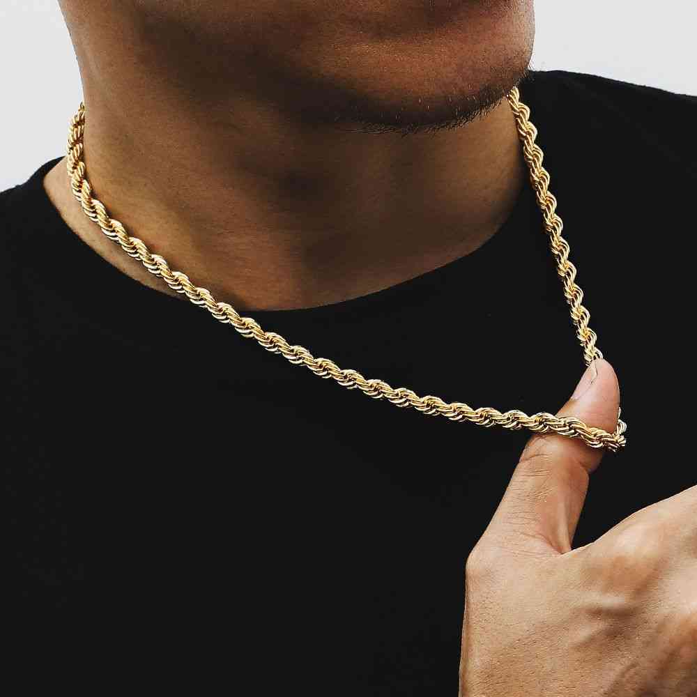 Man wearing a gold plated stainless steel twist chain necklace with a twisted rope design, stylish accessory for modern fashion.