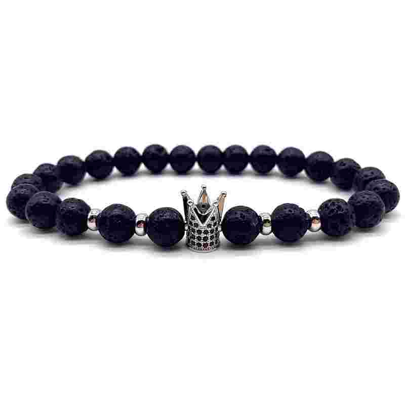 Black volcanic stone beaded stretch bracelet with silver crown charm, round lava stones, elastic band, stylish jewelry accessory