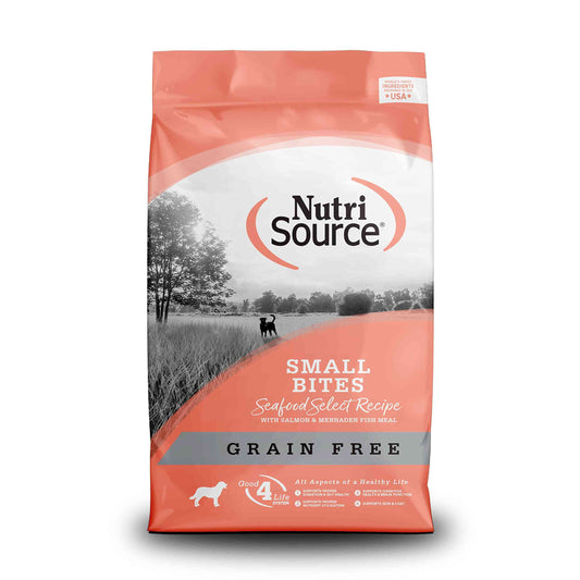 Grain-free salmon dog food bag with a scenic black and white landscape, featuring a dog silhouette and orange accents, 15LB size