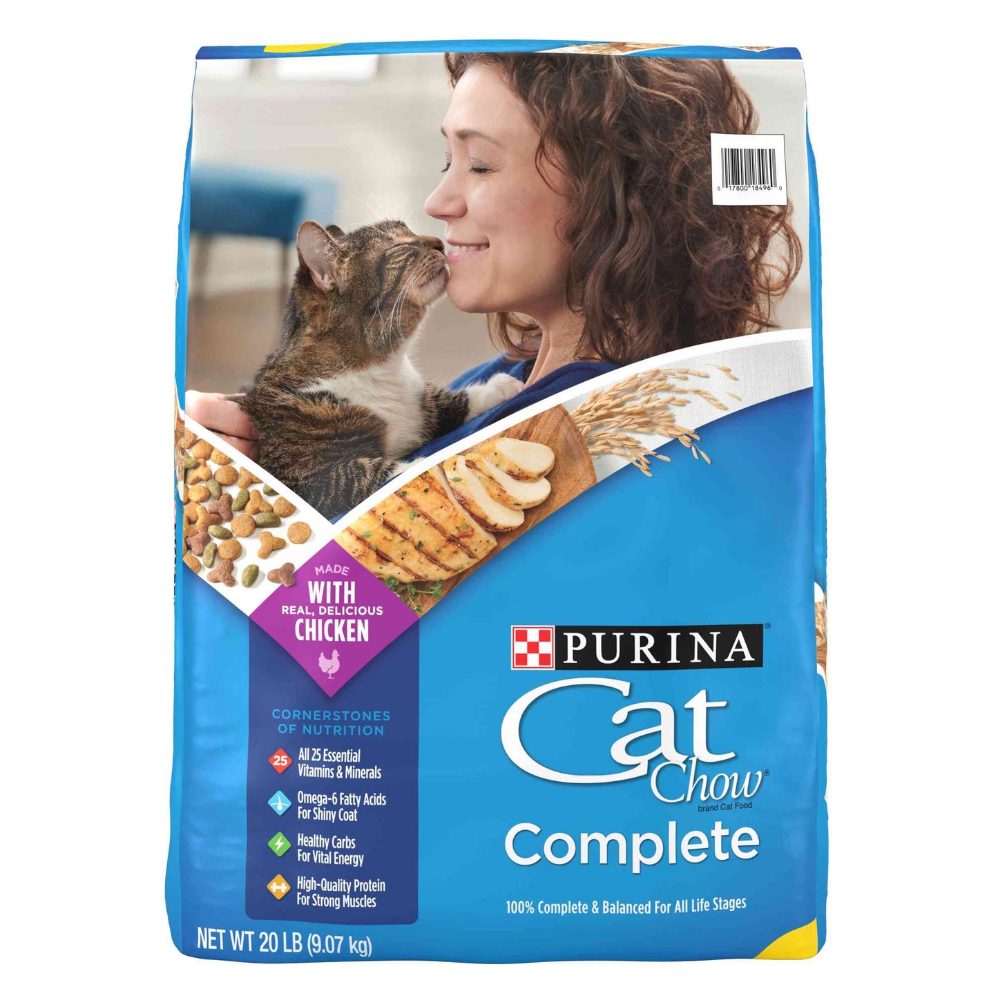 Blue bag of Purina Cat Chow Complete dry cat food with a woman and a cat touching noses, featuring chicken flavor, 20 lb weight